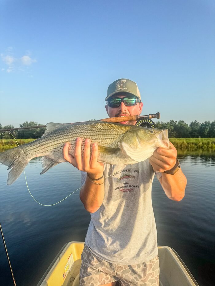 A heavy wiper held up from a boat on flat water at Arcadia